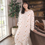 Modal standing in a living room wearing Beige Long Sleeve Adult Sleep Bag Walker in Book Club print
::: Model is 5'9" wearing size S ///