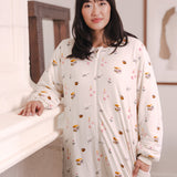 Modal standing wearing Beige Long Sleeve Adult Sleep Bag Walker in Book Club print