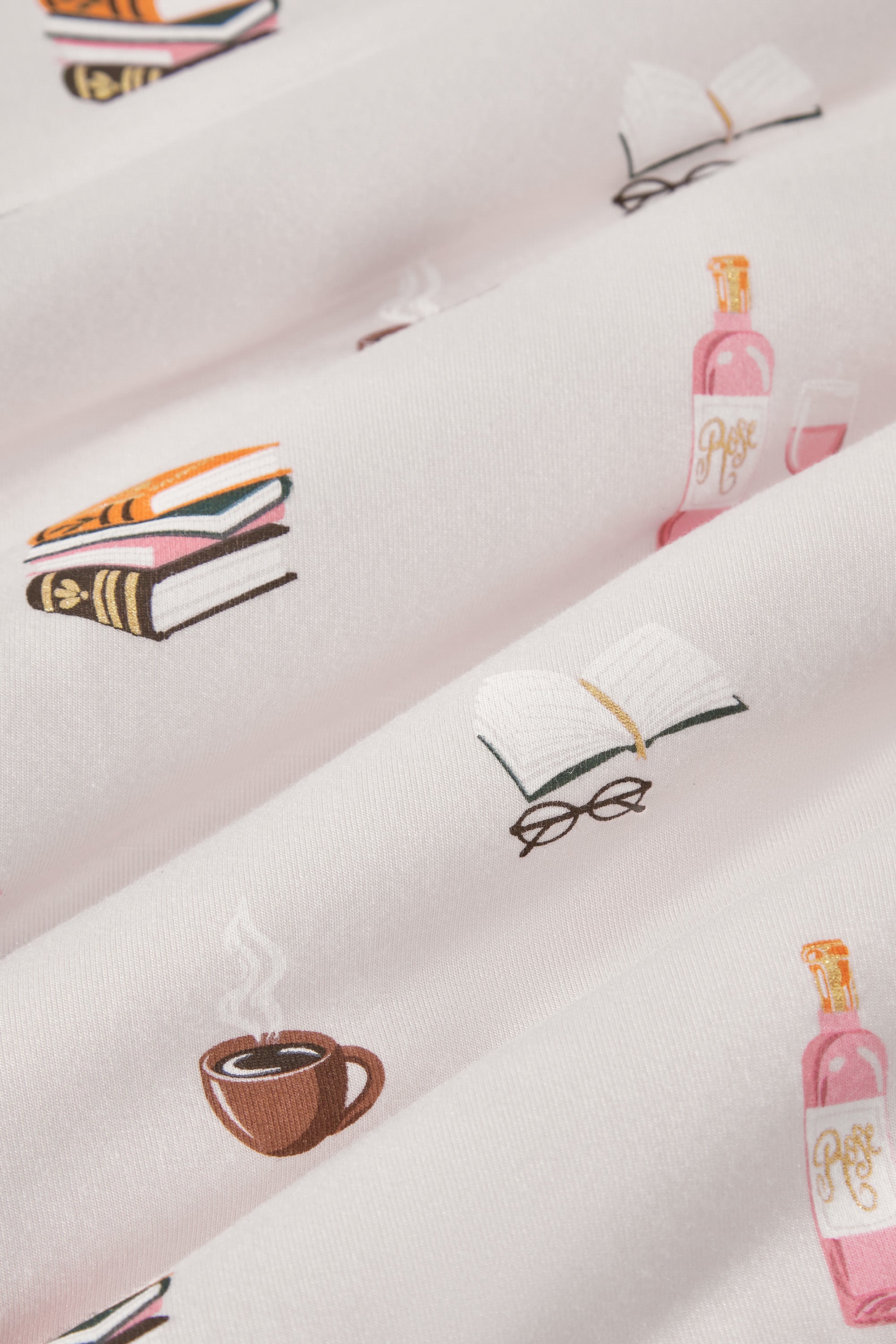 Close up of pink fabric with book club print on it