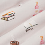 Close up of pink fabric with book club print on it
