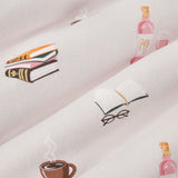 Close up of pink fabric with book club print on it