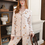 Modal wearing Long-Sleeved Women's Pajama Set in Book Club print posing in a living room
::: Model is 5'8"" wearing size S ///
---PJ 2
