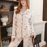 Modal wearing Long-Sleeved Women's Pajama Set in Book Club print posing in a living room
::: Model is 5'8"" wearing size S ///
---PJ 2