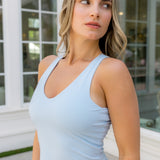 Female modeling the Bamboo Flex Bra Tank in Breeze with matching skort

::: Model is 54" wearing size S ///