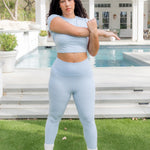Model stretching wearing the Bamboo Flex Women’s Leggings in Breeze with matching baby tee top

::: Model is 5'9" wearing size L ///
