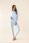 Smiling model wearing the Kyte Bamboo Women's Jogger Pajama Set in Breeze  ::: Model is 5'11" wearing size S ///