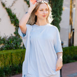 Woman wearing the Biker Short Set in Breeze in an outdoor setting with sunglasses on her head  ::: Model is 5'2" wearing size S ///