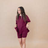 Women modeling the Women's Biker Short Set in Burgundy while looking to the side and smiling