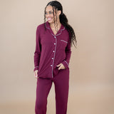 Smiling model looking to the side while wearing the Women's Long Sleeve Pajama Set in Burgundy
