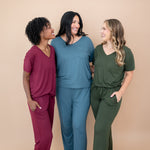 Women standing together modeling the V Neck and Lounge Pants in Burgundy, Atlantic and Fir