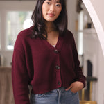 Woman with her hand in her jean pocket wearing cropped cardigan in burgundy
::: Model is 5'9" wearing size S ///