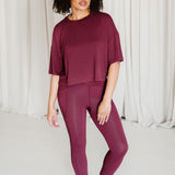 Female wearing the Bamboo Flex Women’s Leggings in Burgundy with matching short sleeve tee