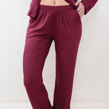 Burgundy pajama set on a plain background