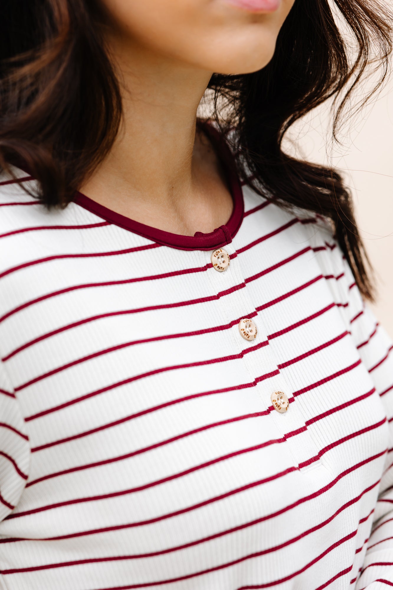 Close up of the Henley top and buttons on the Women's RIbbed Henley Set in Burgundy Stripe