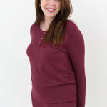 Close up on the top of the Women’s Ribbed Henley Set in Burgundy shown on a smiling female model