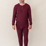Man modeling the Kyte Men's Ribbed Henley Set in Burgundy