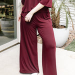 Women's Wide Leg Pant in Burgundy shown on a model