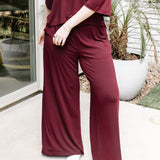 Women's Wide Leg Pant in Burgundy shown on a model
