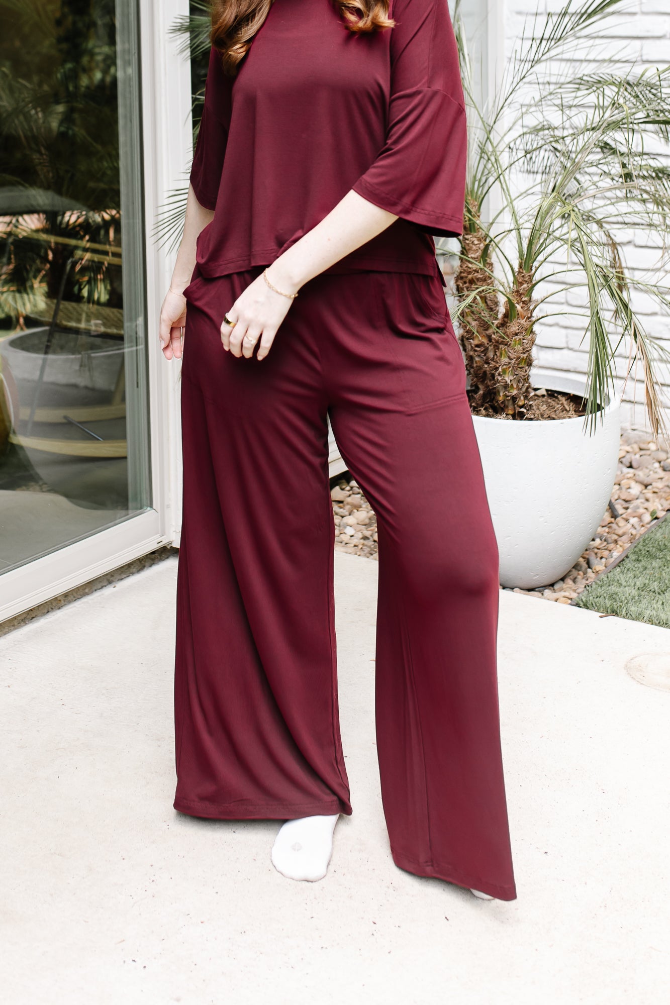 Women's Wide Leg Pant in Burgundy shown on a model