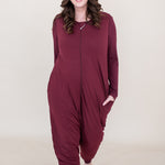 Model walking towards camera while wearing the Adult Sleep Bag Walker in Burgundy