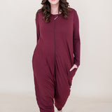 Model walking towards camera while wearing the Adult Sleep Bag Walker in Burgundy