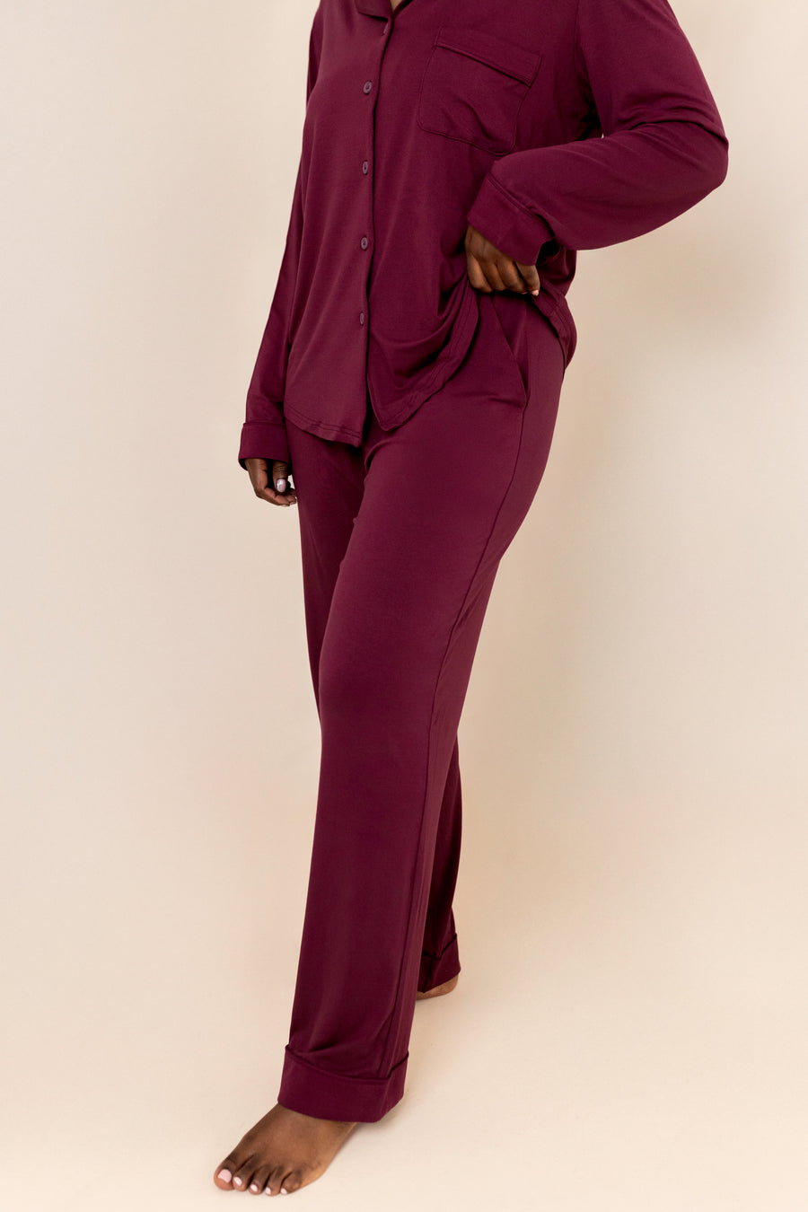 Burgundy pajama set on a plain background