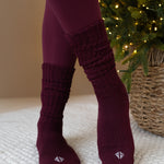 Person wearing Burgundy scrunched socks and matching leggings 
