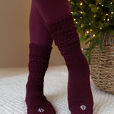 Person wearing Burgundy scrunched socks and matching leggings 