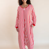 Woman wearing Long Sleeve Adult Sleep Bag Walker in red and white Peppermint Stripe print on a beige background
::: Model is 5'10" wearing size S/M ///