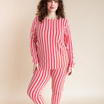 Woman wearing Women's Jogger Pajama Set in red and white Peppermint Stripes print on a beige background
::: Model is 5'10" wearing size XL ///