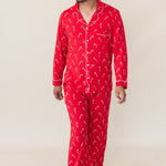 Model in front of a beige background wearing the Men's Long Sleeve Pajama Set in Candy Cane