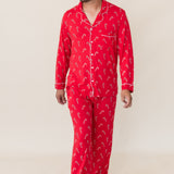 Model in front of a beige background wearing the Men's Long Sleeve Pajama Set in Candy Cane