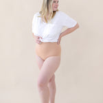 Woman modeling Women's High-Waisted Brief in Chai with a snow V-neck