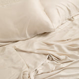 Close up of the Bamboo Sateen Sheet Set in Champagne shown on a bed