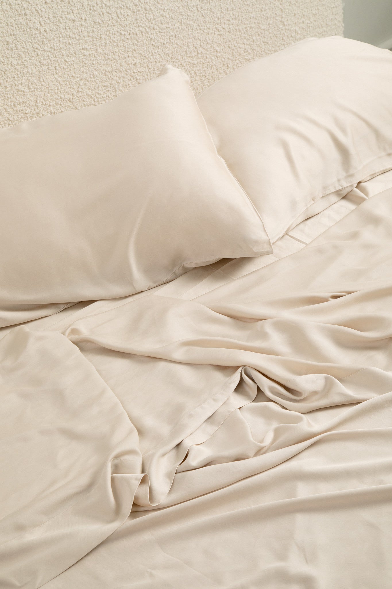 Close up of the Bamboo Sateen Sheet Set in Champagne shown on a bed
