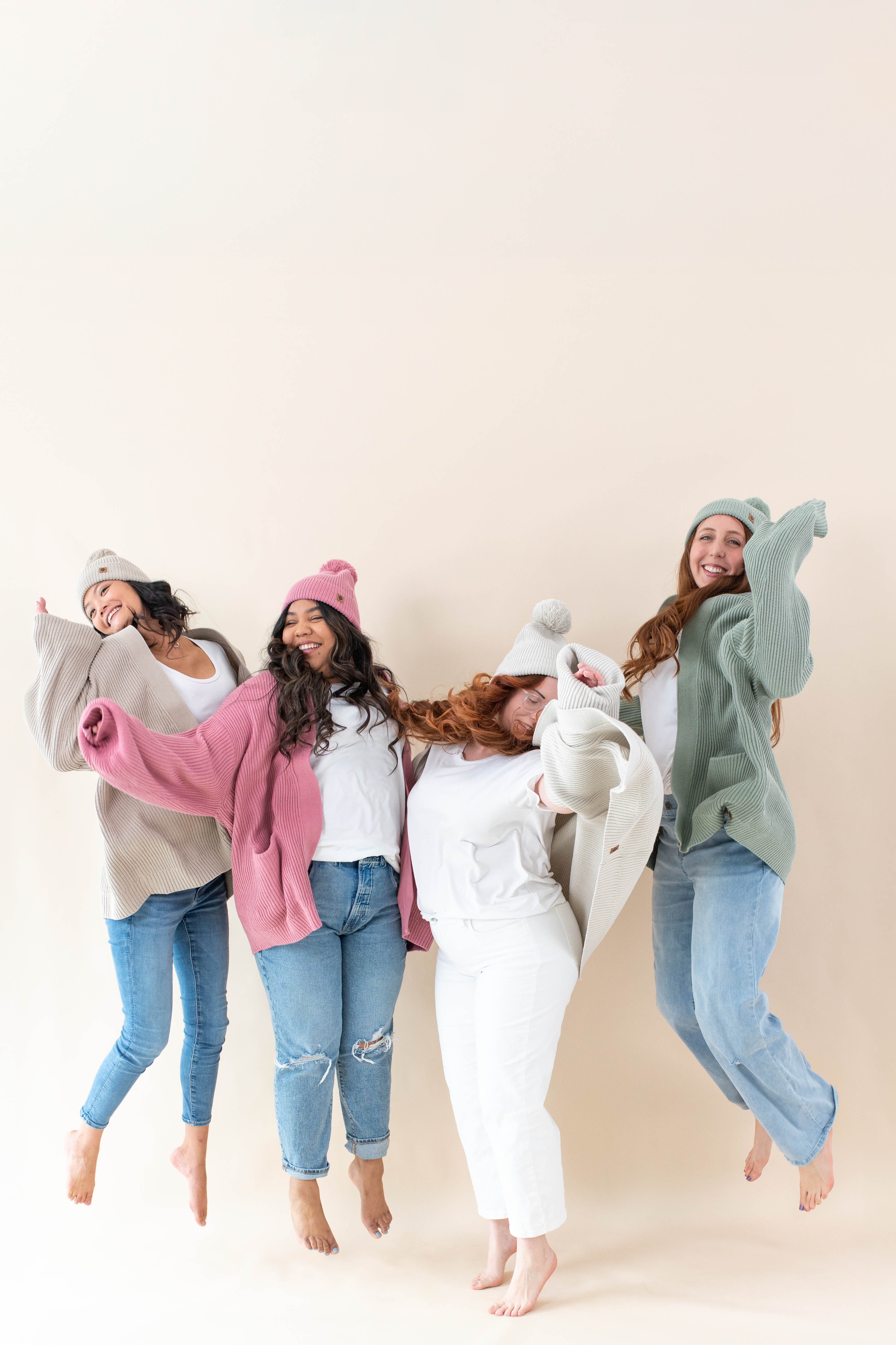 Four Models wearing various colors of the Chunky Knit Women's Oversized Cardigan
