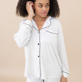 Closer photo of the Women's Long Sleeve Pajama Set in Snow with Midnight Trim with a focus on the pajama top