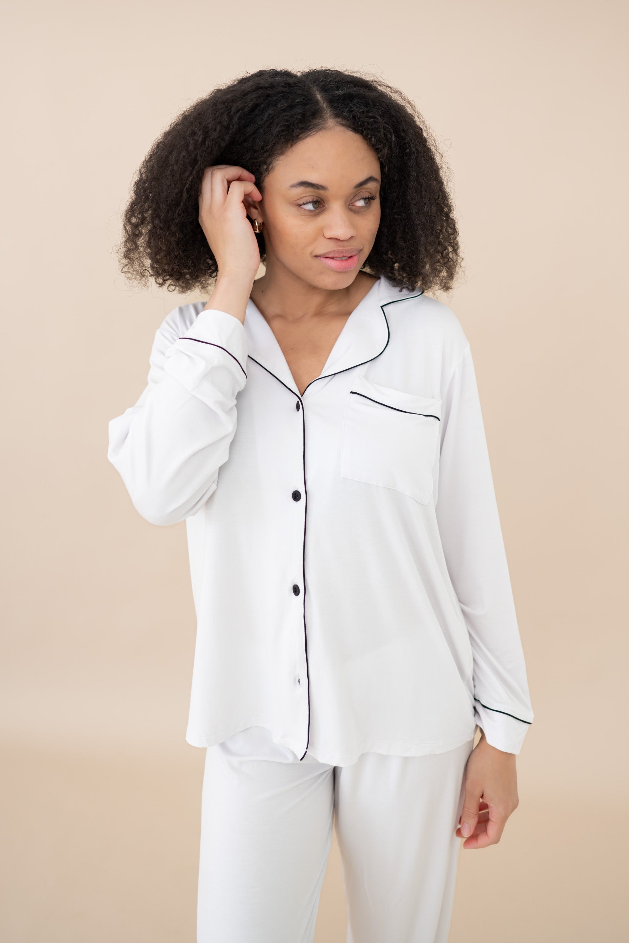 Closer photo of the Women's Long Sleeve Pajama Set in Snow with Midnight Trim with a focus on the pajama top