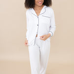 Female Model wearing the Women's Long Sleeve Pajama Set in Snow with Midnight Trim
