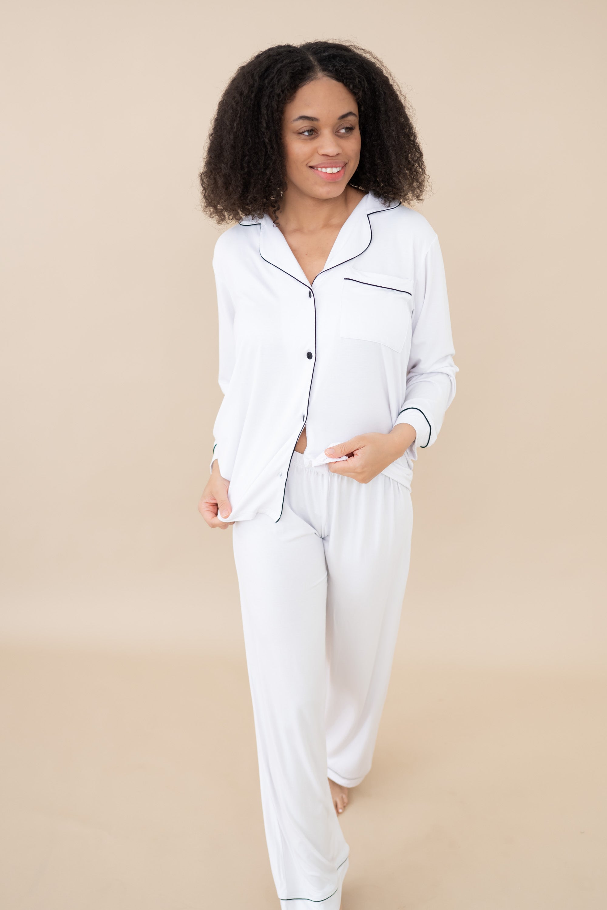 Female Model wearing the Women's Long Sleeve Pajama Set in Snow with Midnight Trim