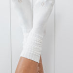 Kyte Scrunch Socks in Cloud shown on a model