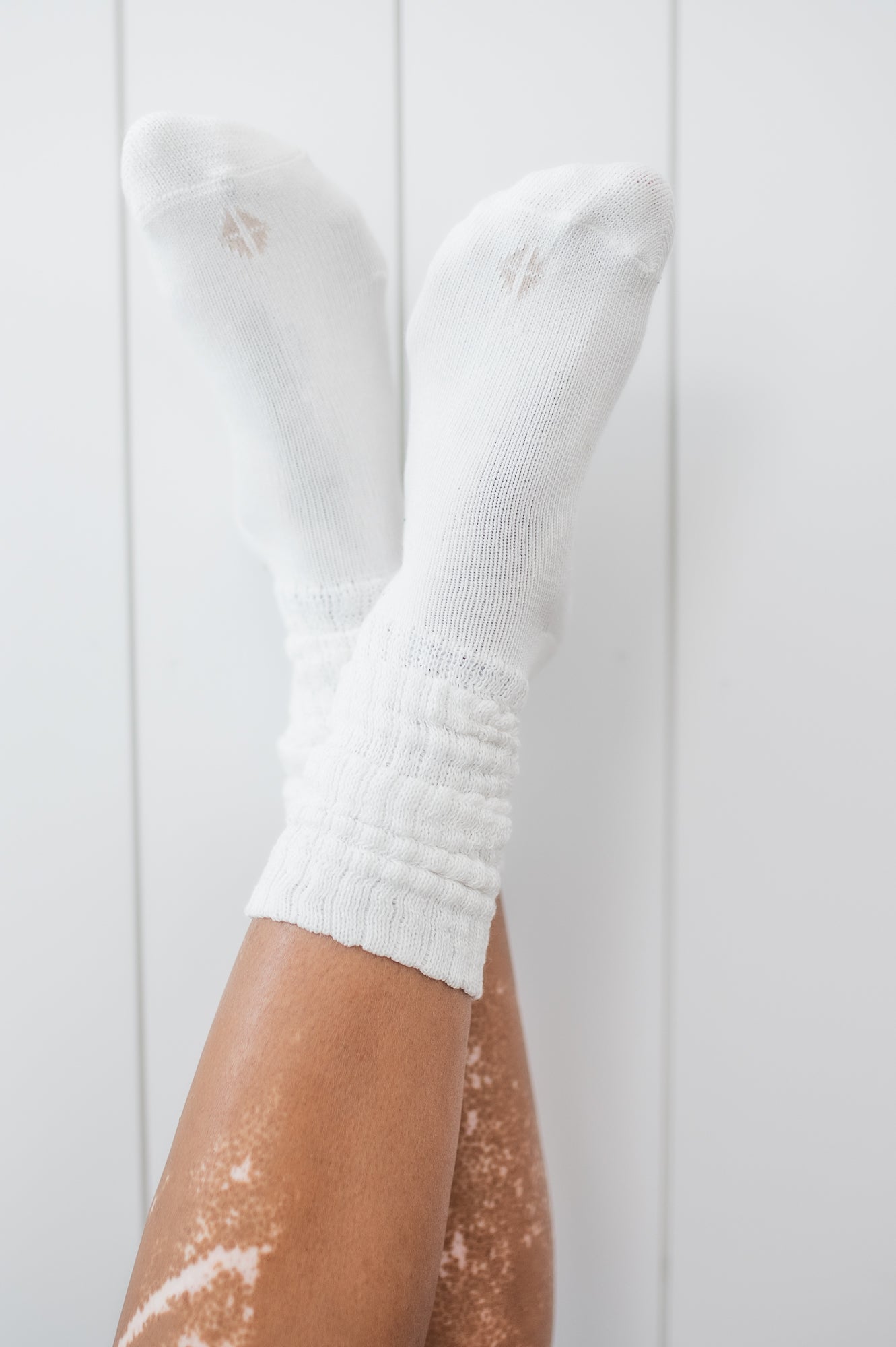 Kyte Scrunch Socks in Cloud shown on a model