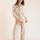 Model wearing Long-Sleeved Women's Pajama Set in Croissant print on a beige background
::: Model is 5'9.5" wearing size XS ///
---1605 3