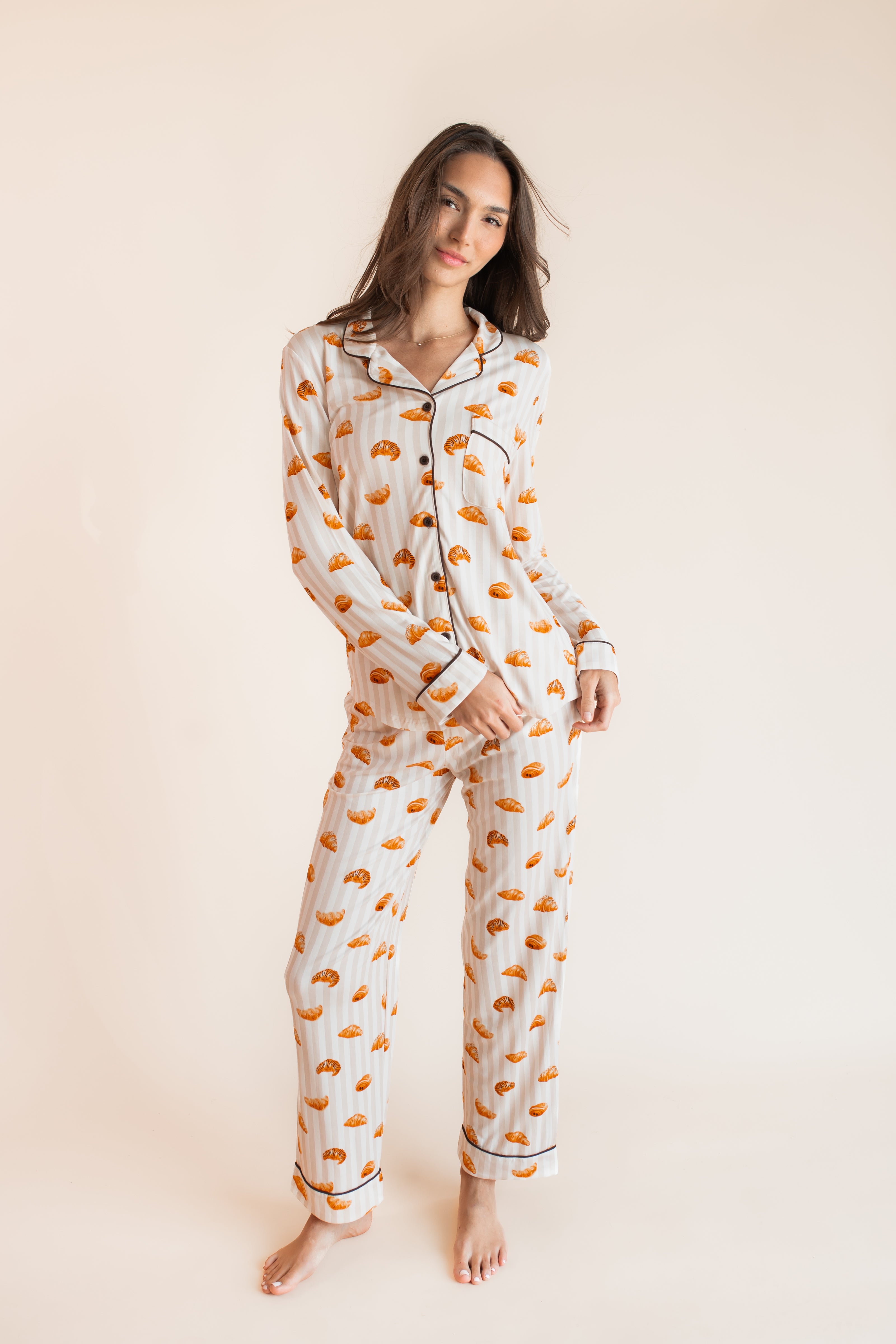 Model wearing Long-Sleeved Women's Pajama Set in Croissant print on a beige background
::: Model is 5'9.5" wearing size XS ///
---1605 3