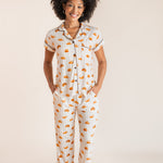 Model wearing Women's Short Sleeve Cropped Pajama Set in Croissant print on a beige background
::: Model is 5'9"" wearing size S ///
