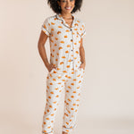 Model posing in Women's Short Sleeve Cropped Pajama Set in Croissant print on a beige background
---PJ 4