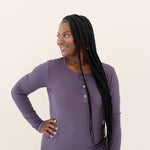 Woman modeling Women's Ribbed Henley Top in Currant looking off to the side