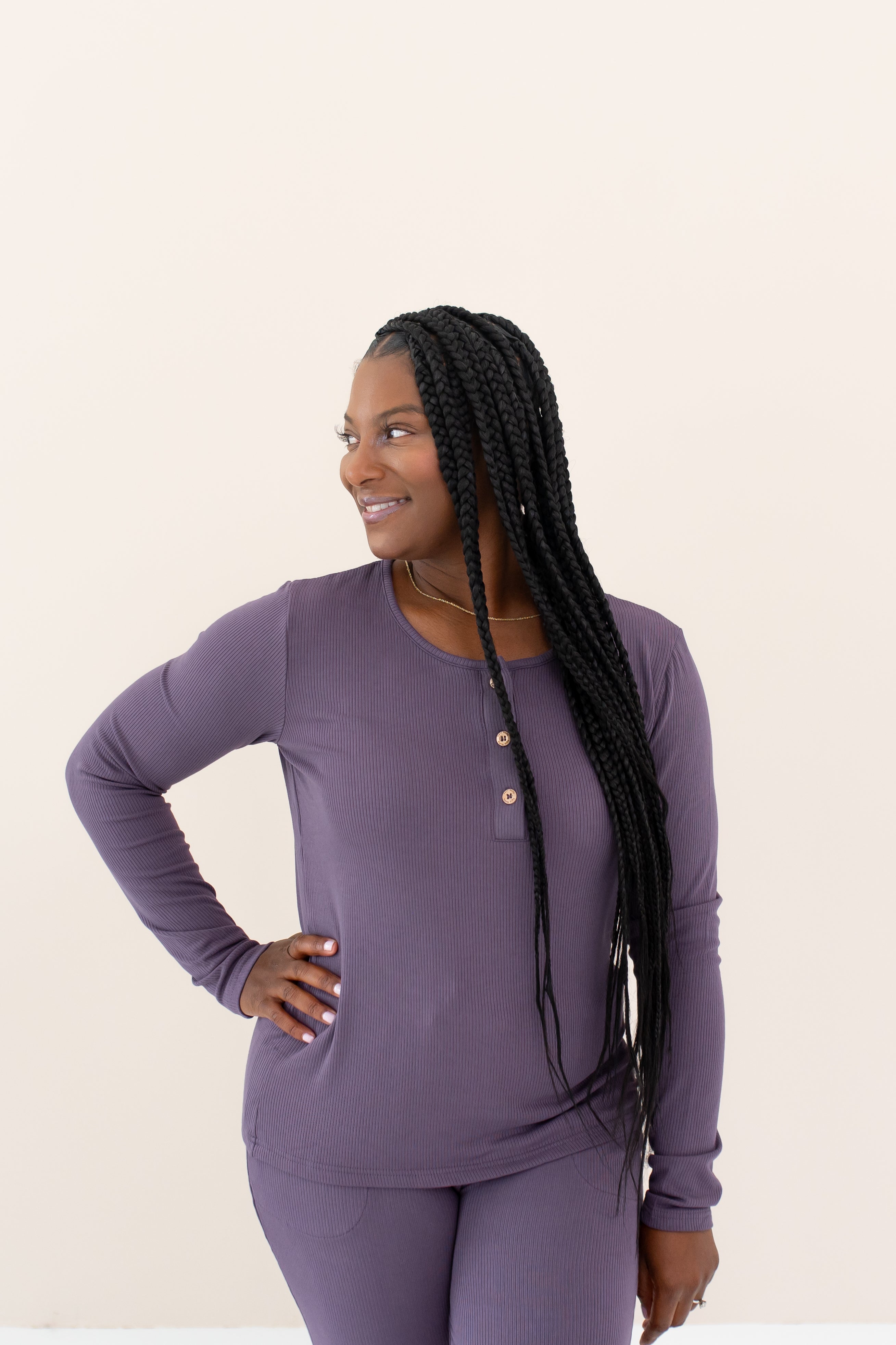 Woman modeling Women's Ribbed Henley Top in Currant looking off to the side