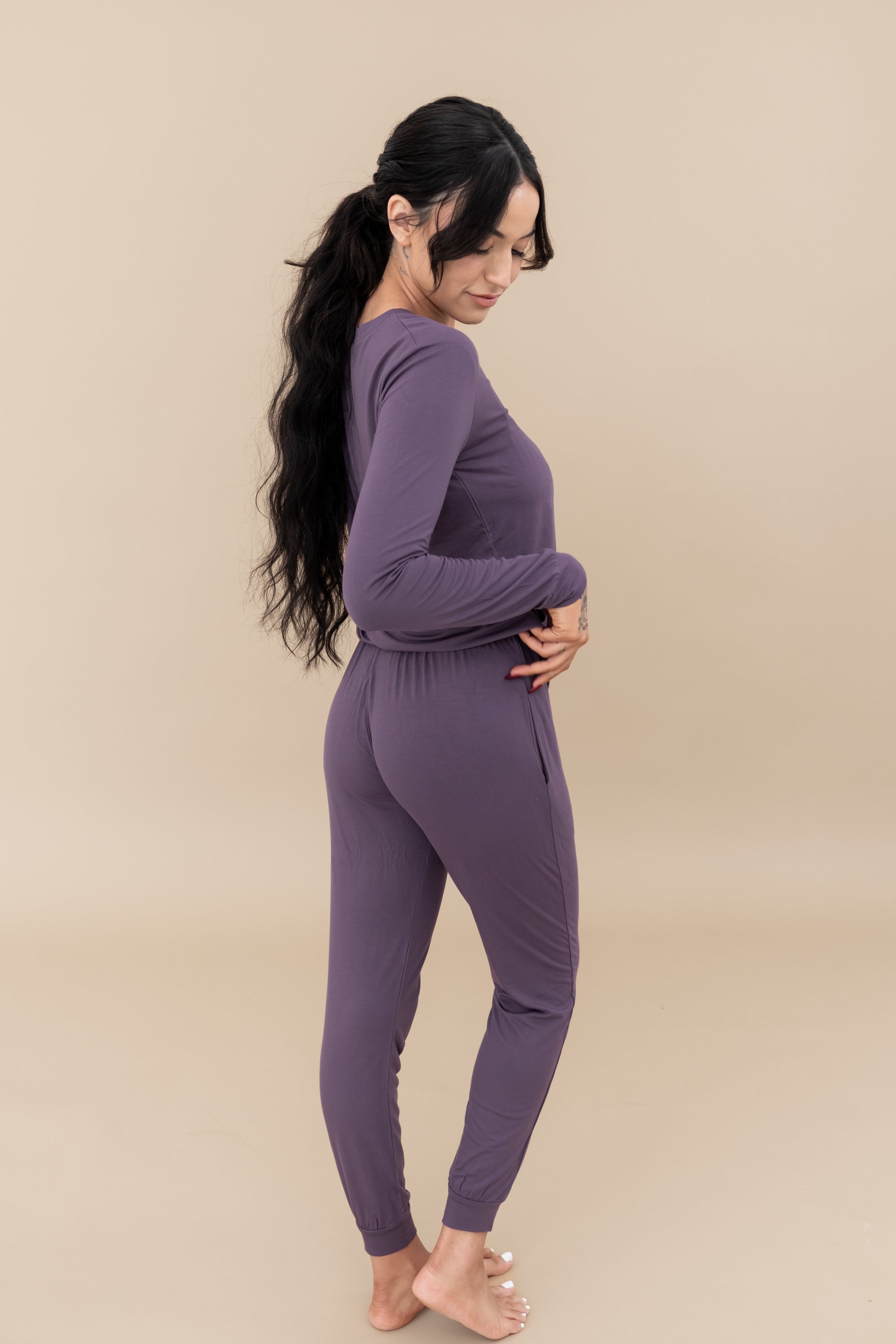 Model showing the backside of the Women's Jogger Pajama Set in Currant