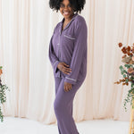 Smiling model wearing the Women's Long Sleeve Pajama Set in Currant with Cloud Trim